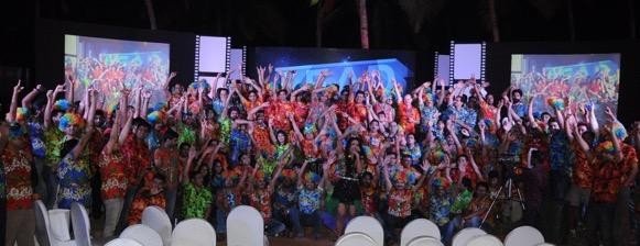 The EMC² sales kick-off crowd in colourful shirts