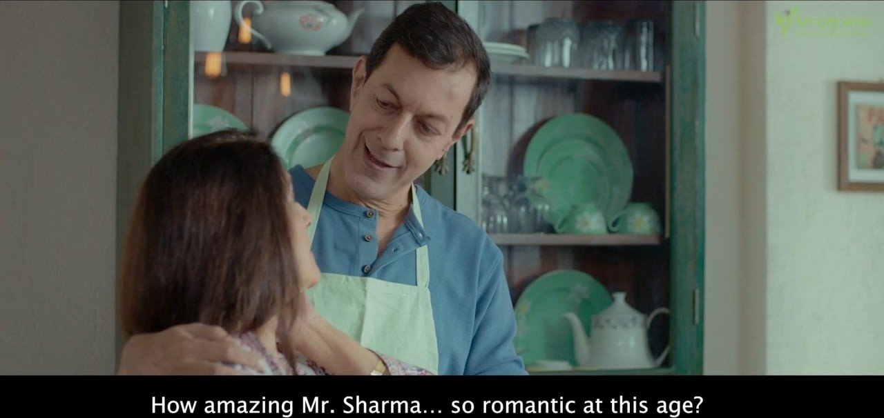 A couple in a kitchen in the film Flower Will
