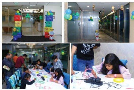 Children building at the MetLife TODAS (The One Day At Office) workshop tables